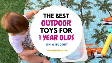 one year old with outdoor toys